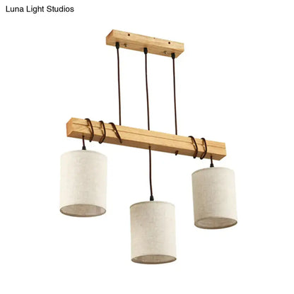 Minimalist wooden chandelier with three off-white fabric shades and black cords for dining room e26 e27 fixture width