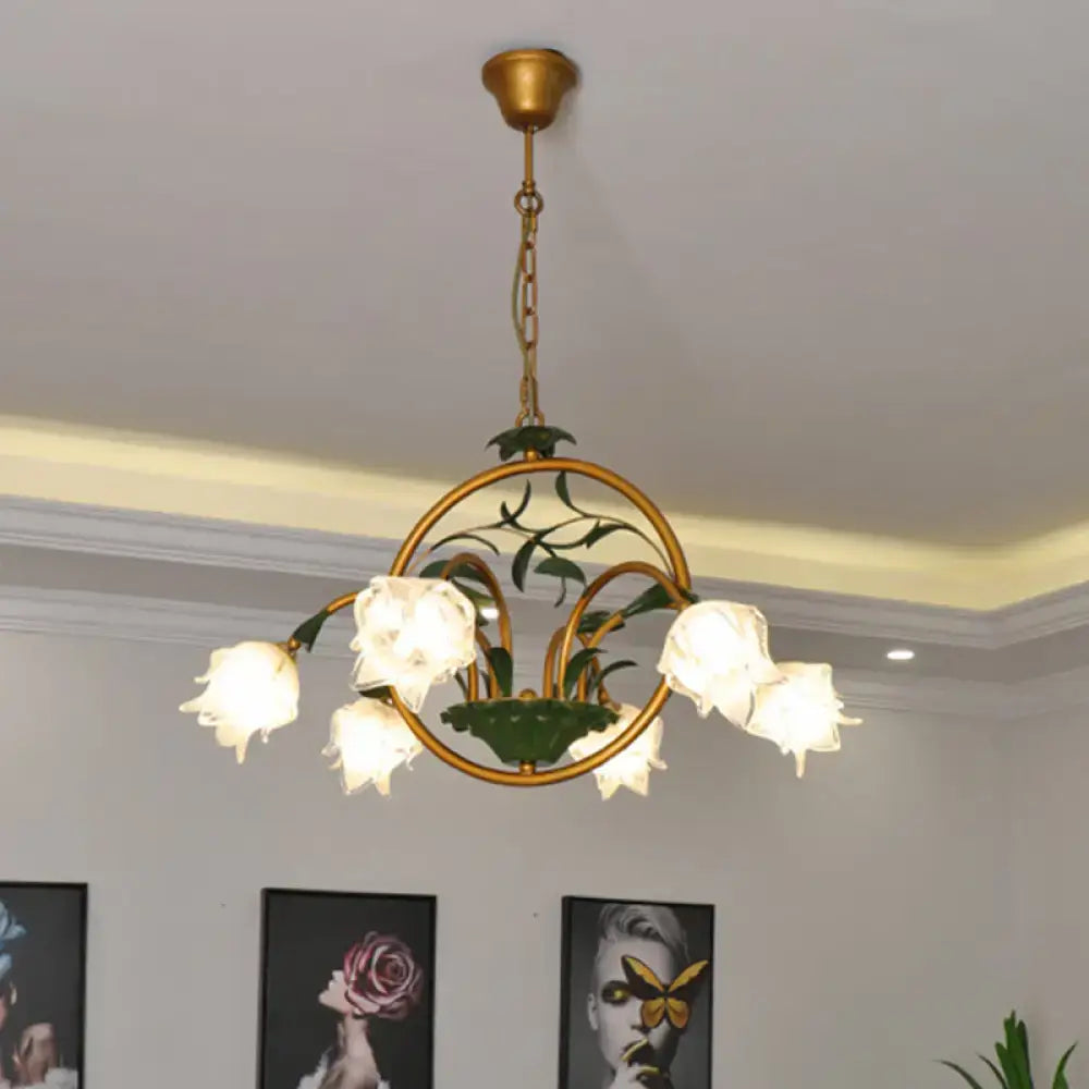 Gold-toned decorbites traditional floral ceiling chandelier with five white petal glass shades and green leaf accents compatible with e12 e14 220v-240v 110v-120v led incandescent fluorescent bulbs