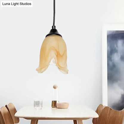 DecorBites™ traditional amber glass pendant light with flower cone shape and black metal fixture for living room use