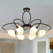 Black metal chandelier with five frosted oval white glass shades and gold-toned accents for traditional decor