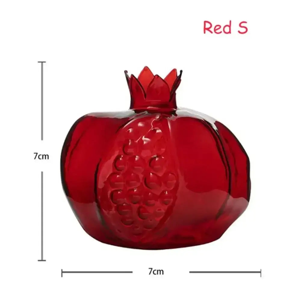 A glossy red glass pomegranate ornament measuring 7cm, shown with decorbites avocado seed starter vase for seed starter use