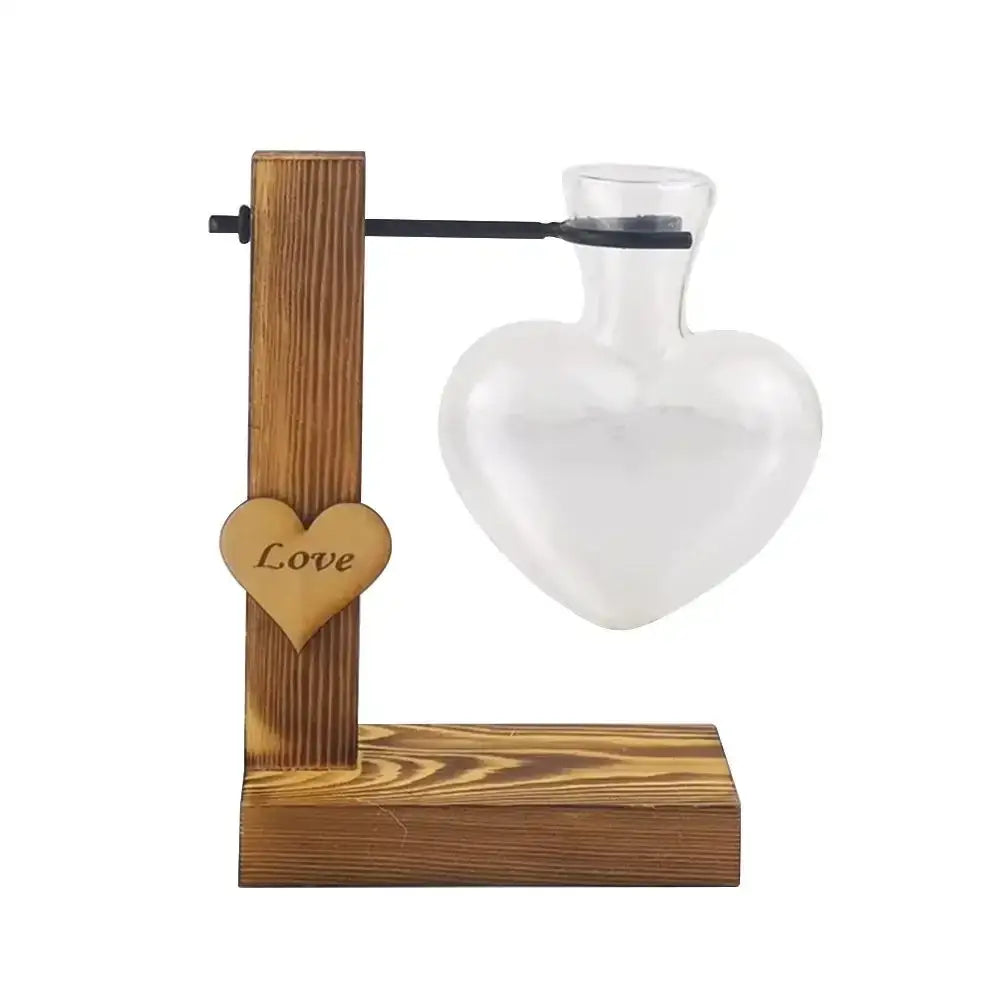 DecorBites™ transparent heart-shaped glass seed starter vase with wooden stand and engraved heart charm for avocado seed