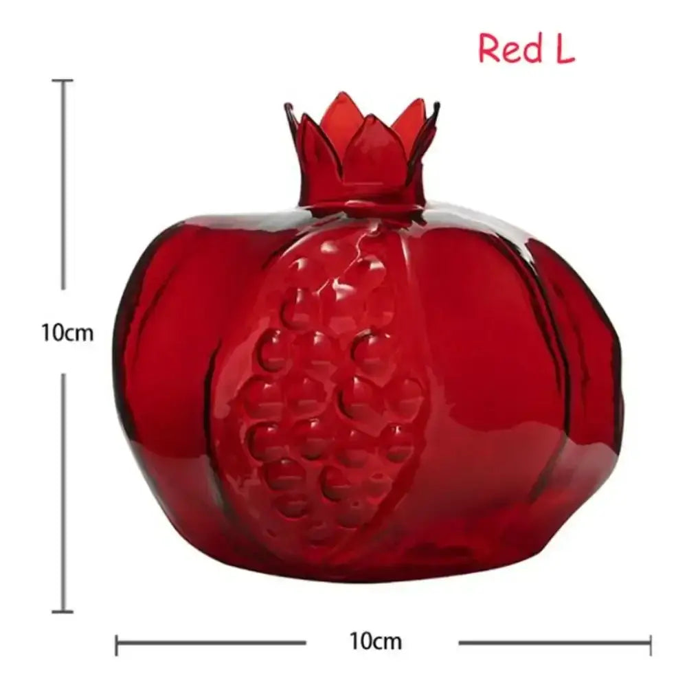 Vibrant red glass pomegranate ornament 10cm used as avocado seed starter in DecorBites™ transparent vase
