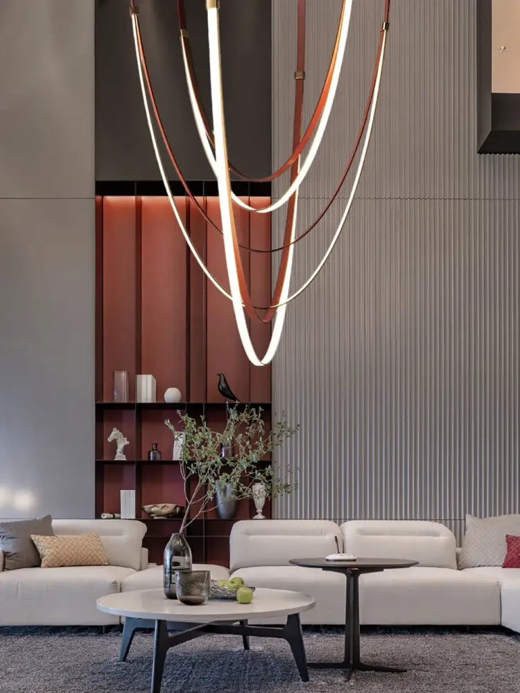 Modern sculptural decorbites™ led chandelier with intertwined copper and white flexible leather belt light strips