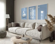 Beige upholstered sectional sofa with dark brown accent pillows next to decorbites™ trendy retro queen of hearts wall art set