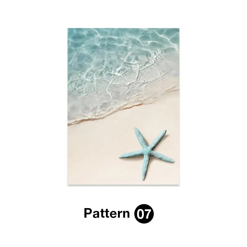 A light blue starfish on sandy beach with clear turquoise water featured in decorbites tropical ocean shell wall art