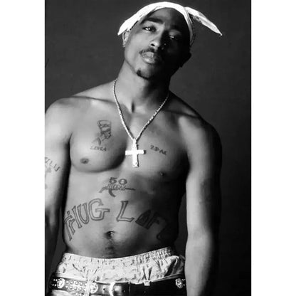 Silver chain necklace with cross pendant displayed alongside decorbites tupac canvas print hip hop wall art