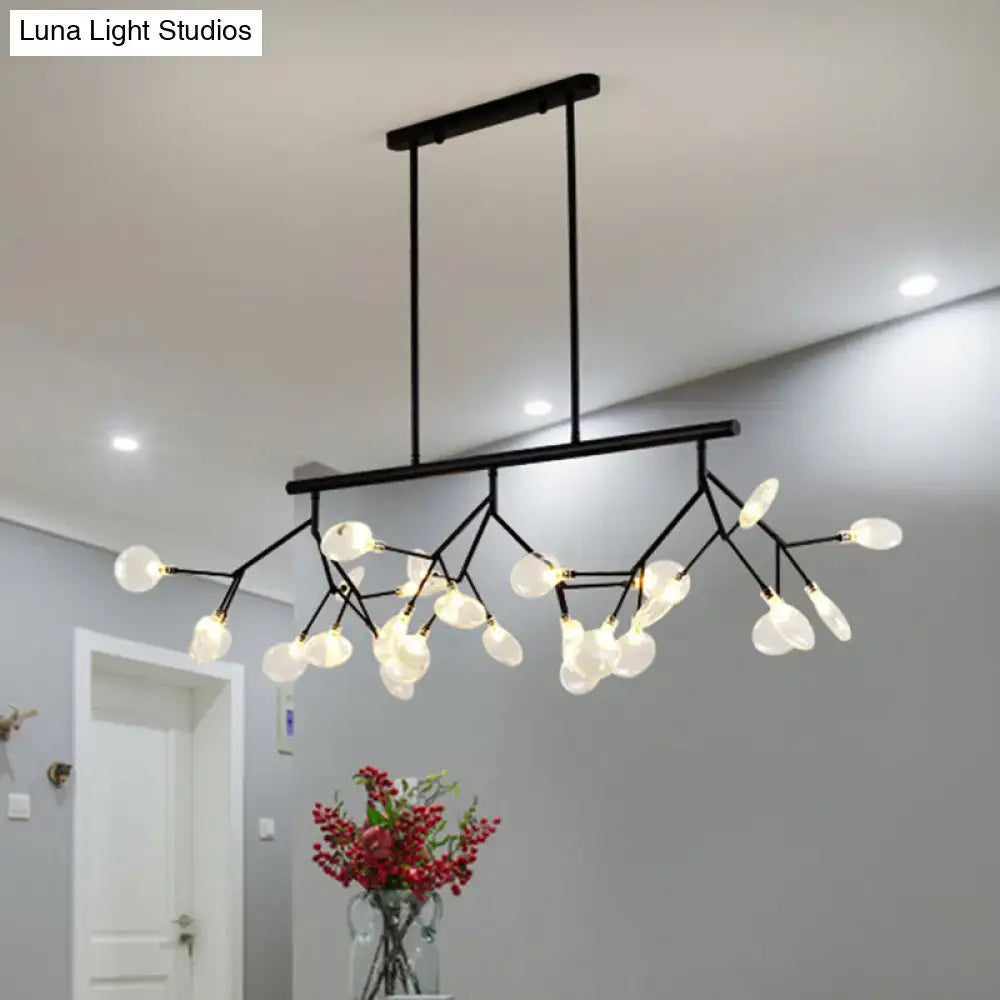 Black metal chandelier with branching arms and frosted glass globe shades for dining room light fixture decorbites