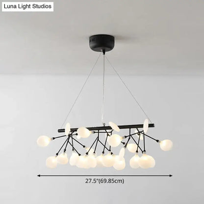 Black metal linear firefly pendant lighting with frosted glass globe ceiling light in a branching design for living room