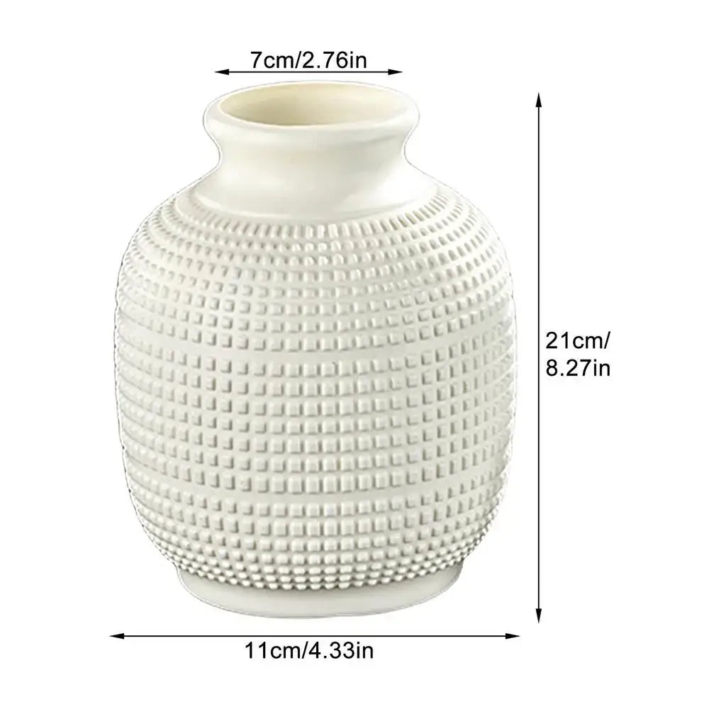 A white ceramic decorbites unbreakable modern floral vase with textured grid pattern for home decor