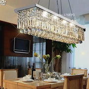 DecorBites™ upscale modern crystal chandelier with a rectangular metallic frame and cascading glass for dining room