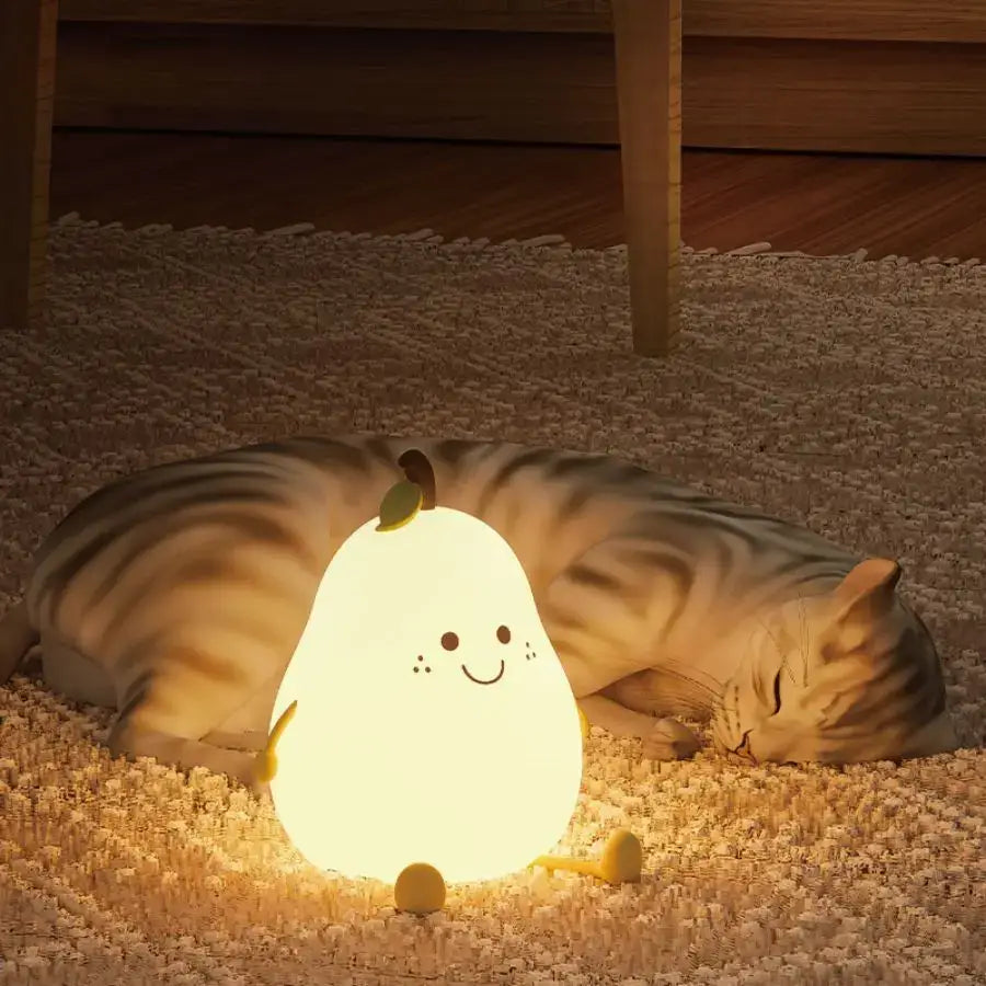 Soft glowing pear-shaped rechargeable silicone night light with smiling face and green leaf for kids bedroom decor