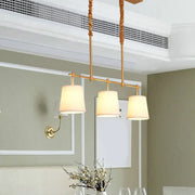 DecorBites™ vintage 3-head brass pendant light with gold-toned twisted rope cords and cream fabric shades for bucket island use