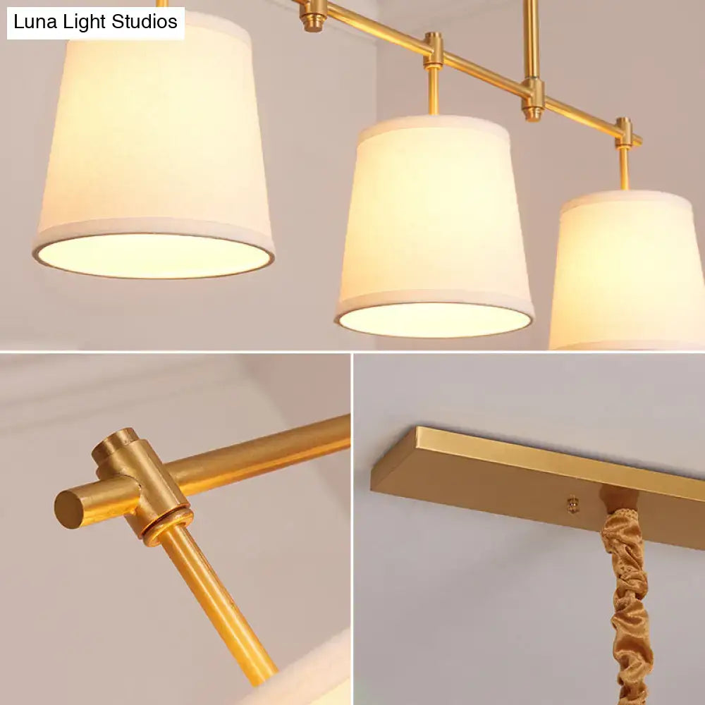 DecorBites™ vintage gold-toned bucket island pendant light with three white fabric shades in retro style bucket design