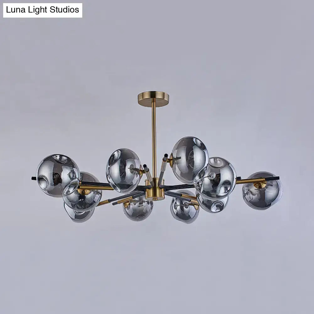 Modern flush mount chandelier with brass frame and silver mirrored glass globes for elegant living room lighting