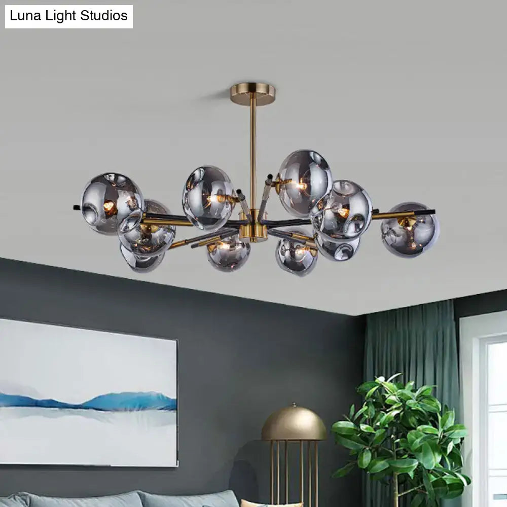 Modern brass-finished flush mount chandelier with frosted glass spheres for elegant living room lighting by DecorBites™