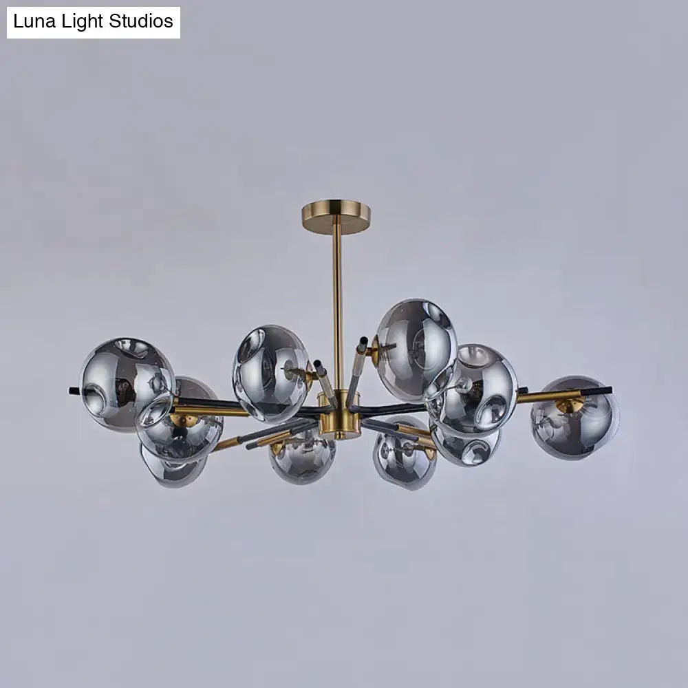 Modern brass flush mount chandelier with multiple reflective silver glass spheres for elegant living room lighting