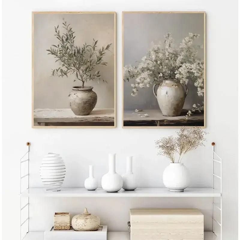 Two framed DecorBites™ vintage floral vase canvas wall art featuring ceramic vases with olive branches and white flowers