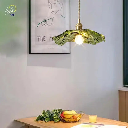 Green leaf-shaped flower glass pendant lights with brass hardware for elegant home decor by DecorBites Vintage