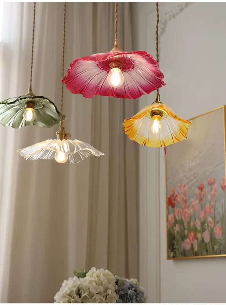 Three hanging DecorBites™ vintage flower glass pendant lights in pink green and yellow with brass fixtures for home decor