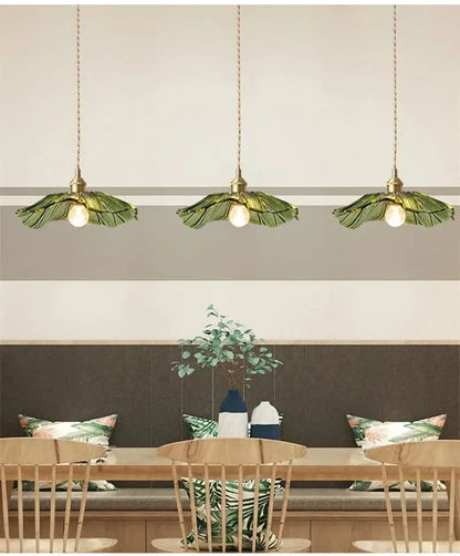 Three decorbites vintage flower glass pendant lights with brass fixtures and green leaf-shaped shades for home decor