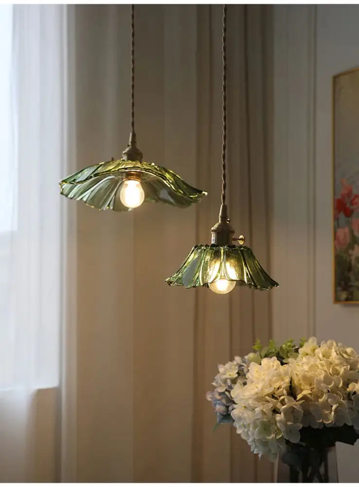 Two green flower glass pendant lights with leaf design and brass fixtures for home decor by decorbites vintage