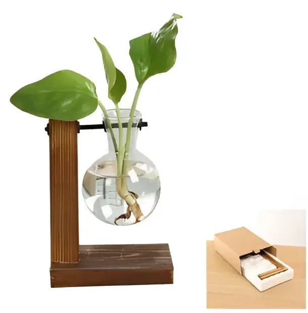 DecorBites™ vintage heart-shaped wooden frame glass vase with clear glass sphere holding green plant stems and leaves