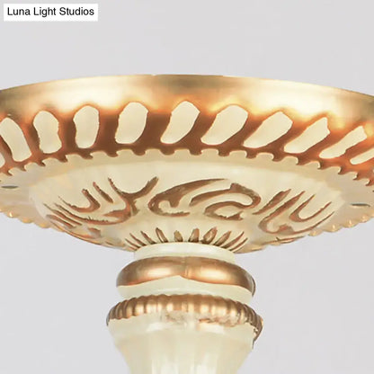 Gold and cream ornate pedestal with intricate carved patterns for DecorBites™ vintage multi-light bowl hanging chandelier living room
