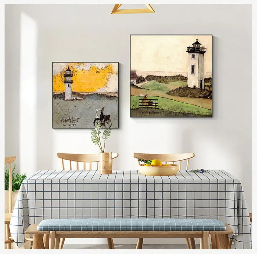 Two framed vintage nordic abstract lighthouse paintings hang above a dining table in decorbites canvas art style