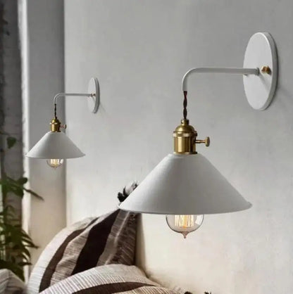 White conical shade vintage plated wall lamp with brass accents and visible filament bulb by decorbites