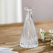 Clear crystal vintage relief vase with faceted geometric patterns and slender neck for hydroponic plants by decorbites
