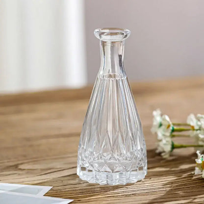 Clear crystal vintage relief vase with faceted geometric patterns and slender neck for hydroponic plants by decorbites