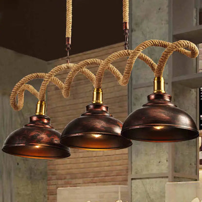 Industrial-style copper dome island light pendant with vintage rust finish and braided rope cord by decorbites