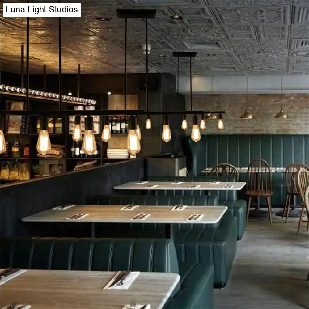 Decorbites vintage style 5-head black finish linear island lamp with metallic fixtures and exposed filament bulbs above dining tables