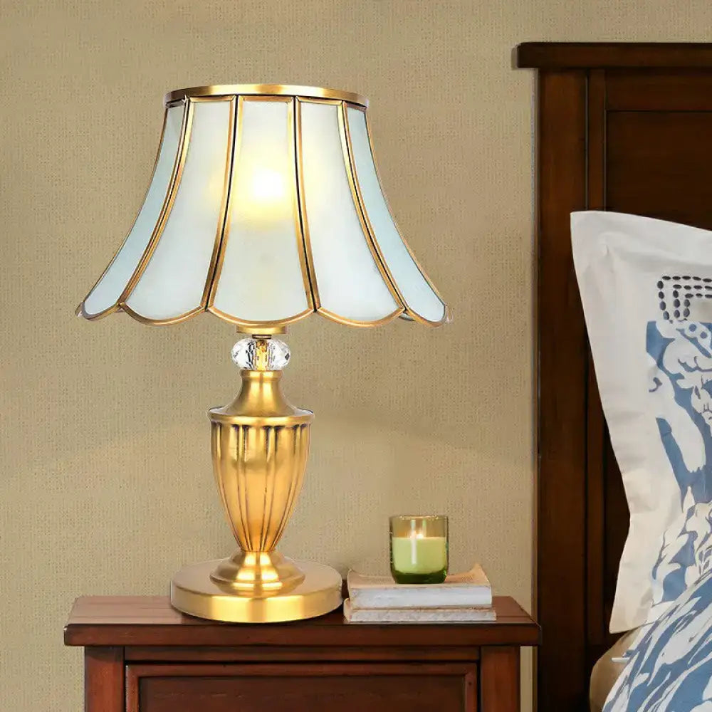 Gold-toned decorbites vintage style nightstand lamp with scalloped opaque glass shade and crystal accent for bedroom use