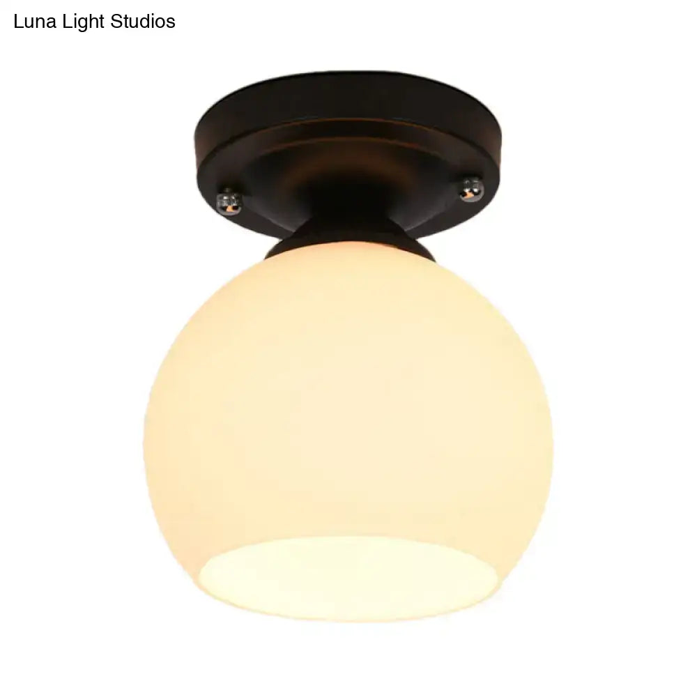 Black metal semi flush ceiling light with frosted opal glass shade from decorbites for hallway use