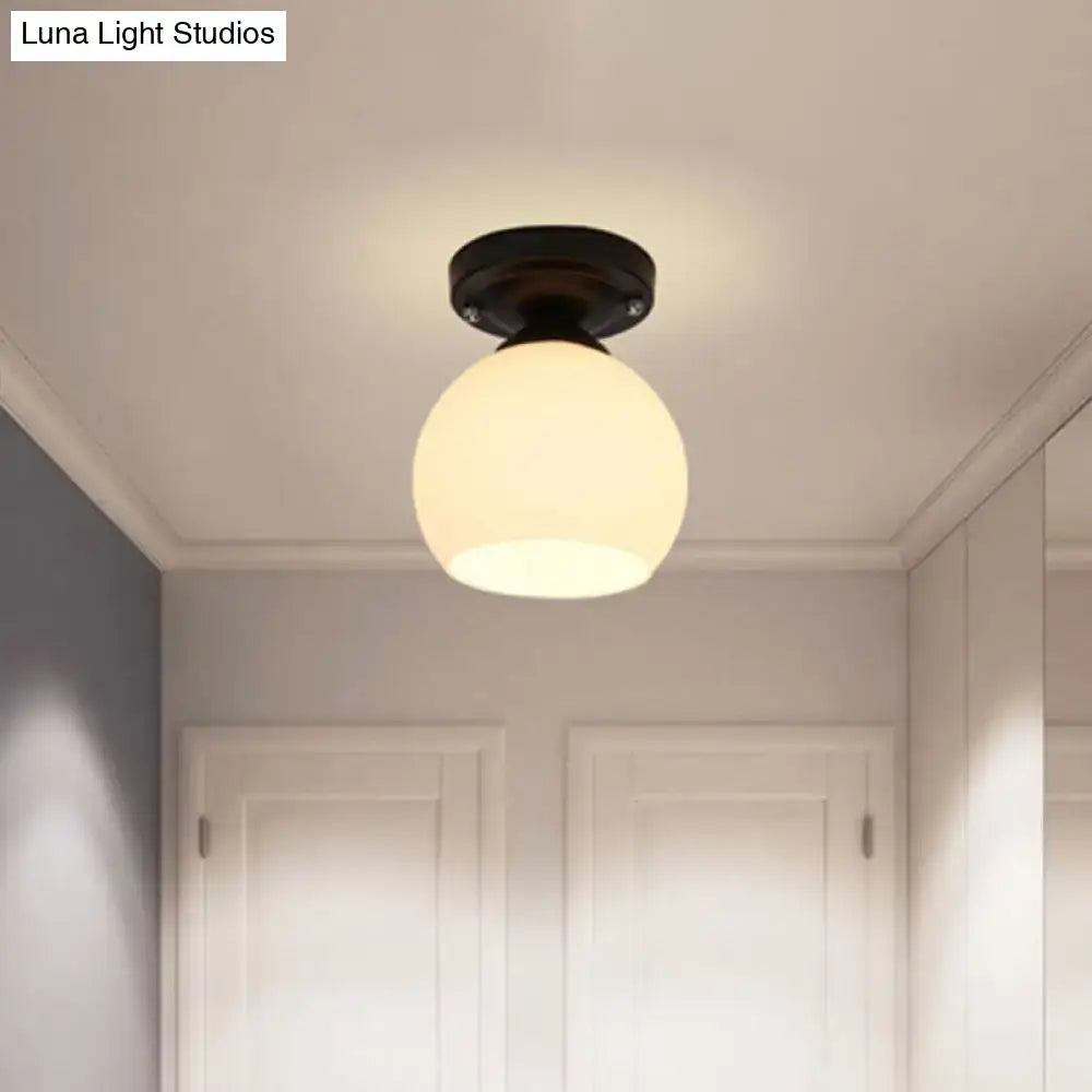 Decorbites vintage style semi flush ceiling light with warm glowing opal glass shade and black metal finish
