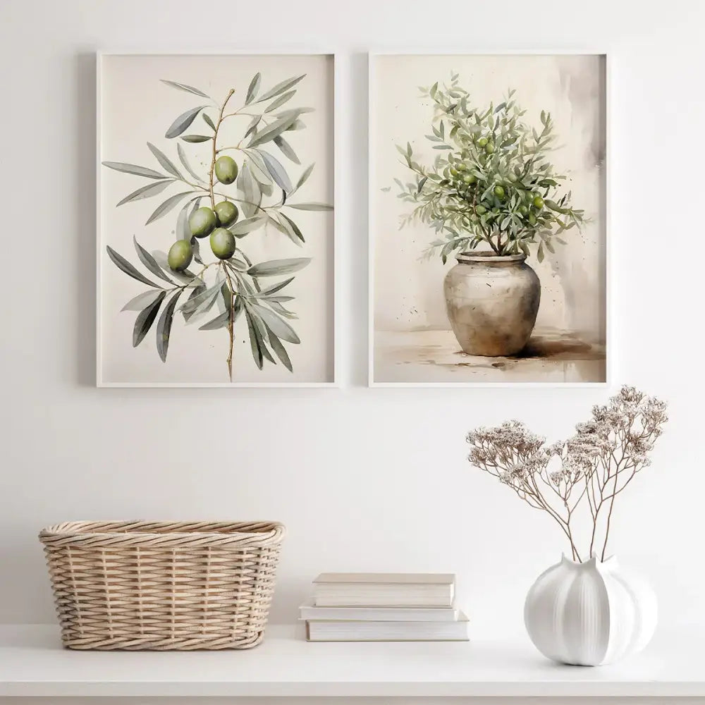 Two framed vintage watercolor olive branch botanical prints hang above a white shelf in the DecorBites™ set