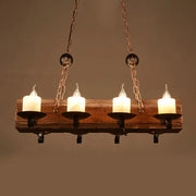 Rustic wooden chandelier with four glowing white candle-style led bulbs in black metal holders and copper chains for 110v-120v use