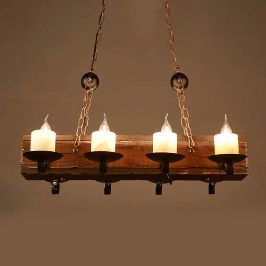 Rustic wooden chandelier with four glowing white candle-style led bulbs in black metal holders and copper chains for 110v-120v use