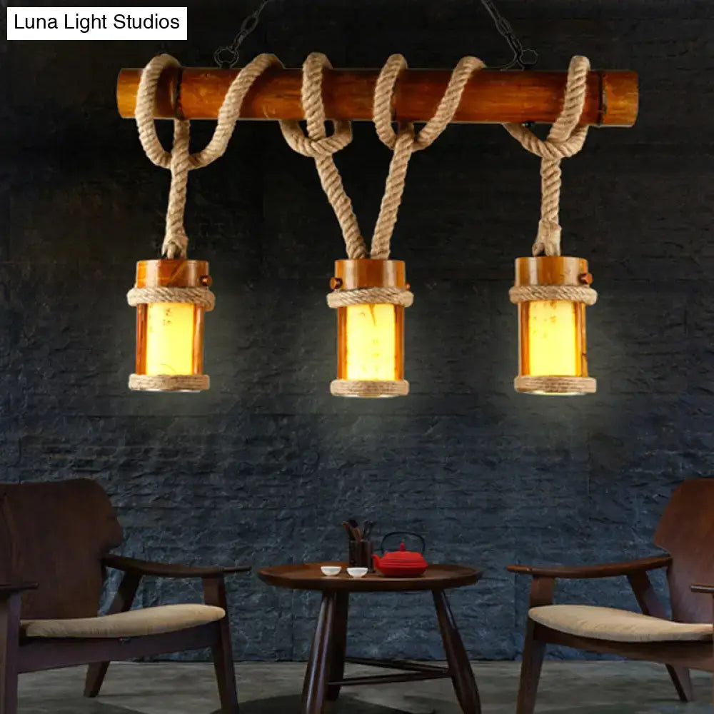 Rustic bamboo chandelier with three warm glass lanterns and thick beige rope cord for 220v-240v vintage lighting