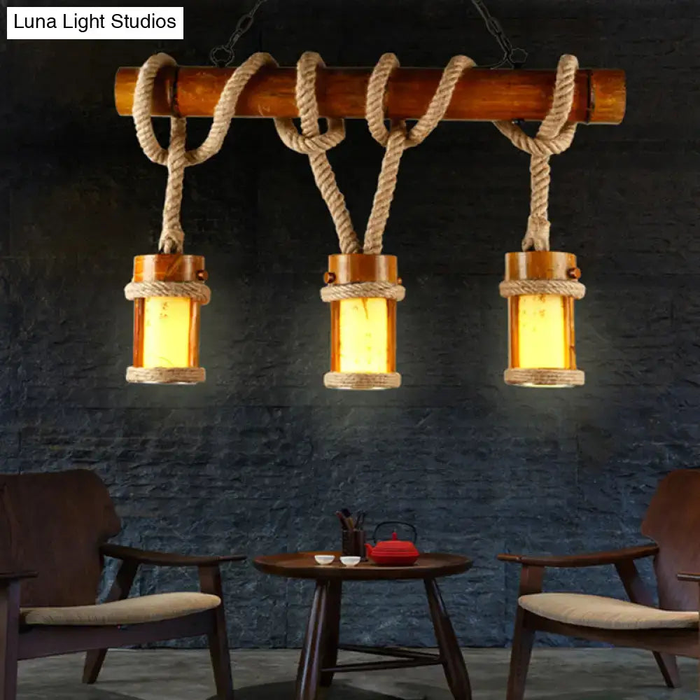 Rustic wooden beam chandelier with three amber glass lanterns wrapped in beige rope cord for 110v-120v use