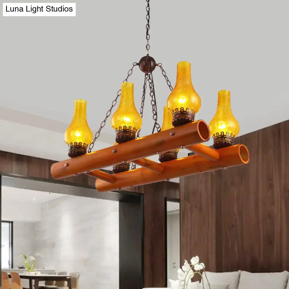 Decorbites™ vintage pendant light featuring warm yellow crackle glass lanterns with bamboo ladder design and dark metal chains