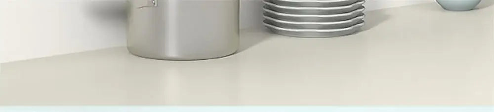 Stack of silver metal plates in decorbites™ wall mounted shelves designed for sleek wall mounted storage solutions