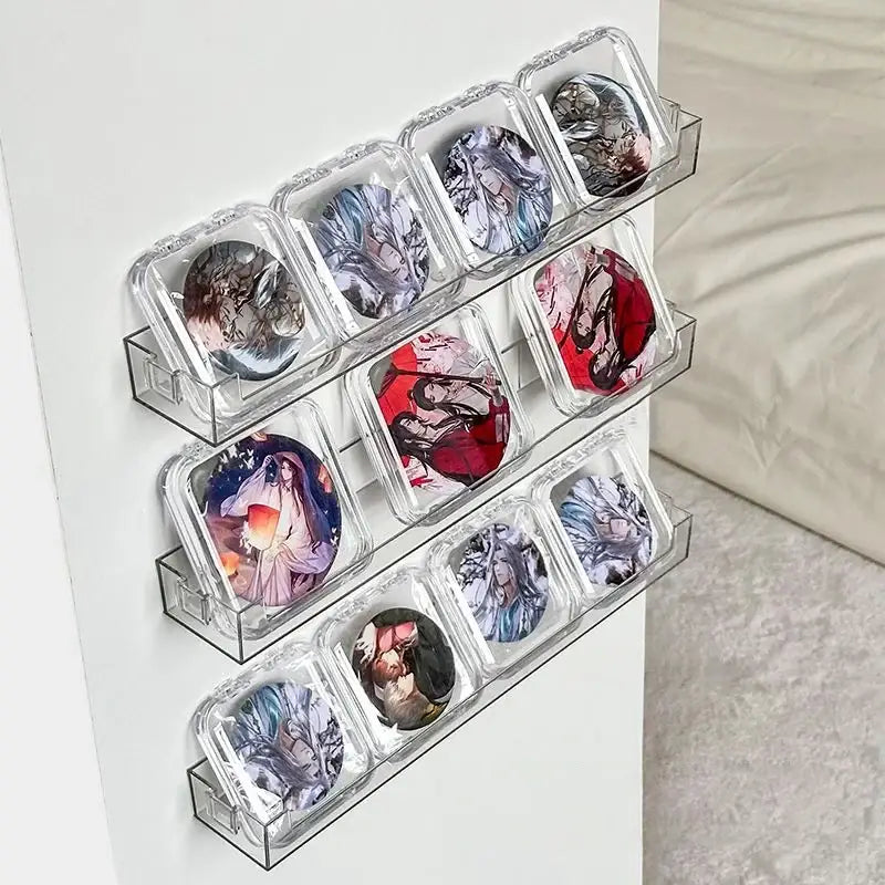 Clear acrylic decorbites™ wall mounted transparent storage rack holding ten anime-themed pin badges in cases