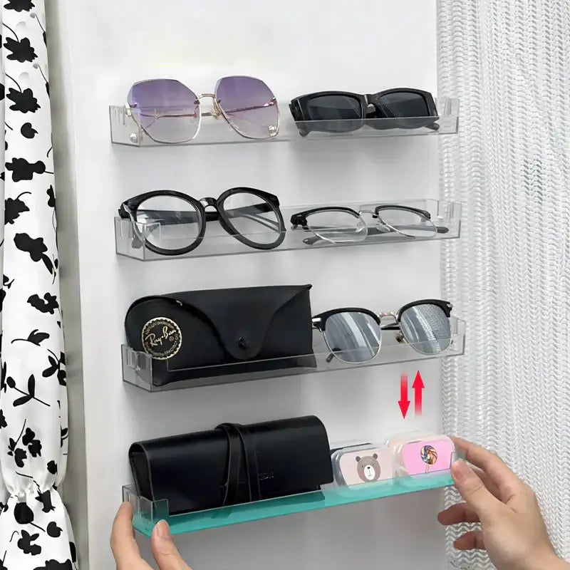 DecorBites™ clear acrylic wall mounted transparent storage rack holding multiple pairs of eyewear and accessories