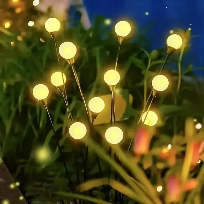 DecorBites™ warm white solar led firework lights with glowing spherical bulbs on slender black stakes for outdoor decor