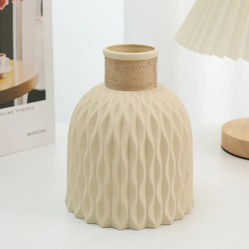 Beige ceramic ripple plastic vase with textured water ripple pattern and natural twine-wrapped neck in modern nordic style