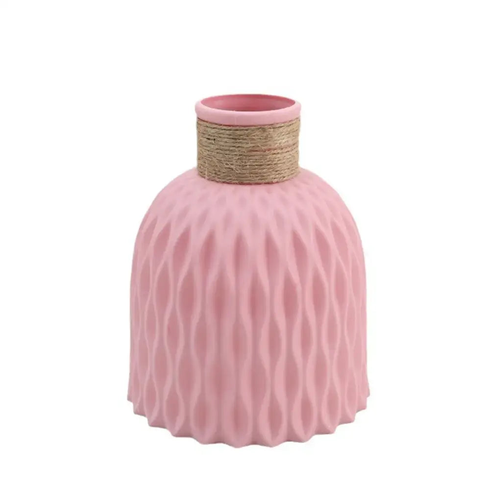 Pink DecorBites™ water ripple plastic vase with textured wavy surface and natural twine-wrapped neck in modern Nordic style