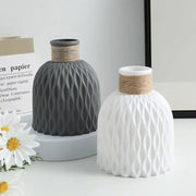 Two DecorBites™ water ripple plastic vases in matte gray and white with twine bands in modern Nordic style